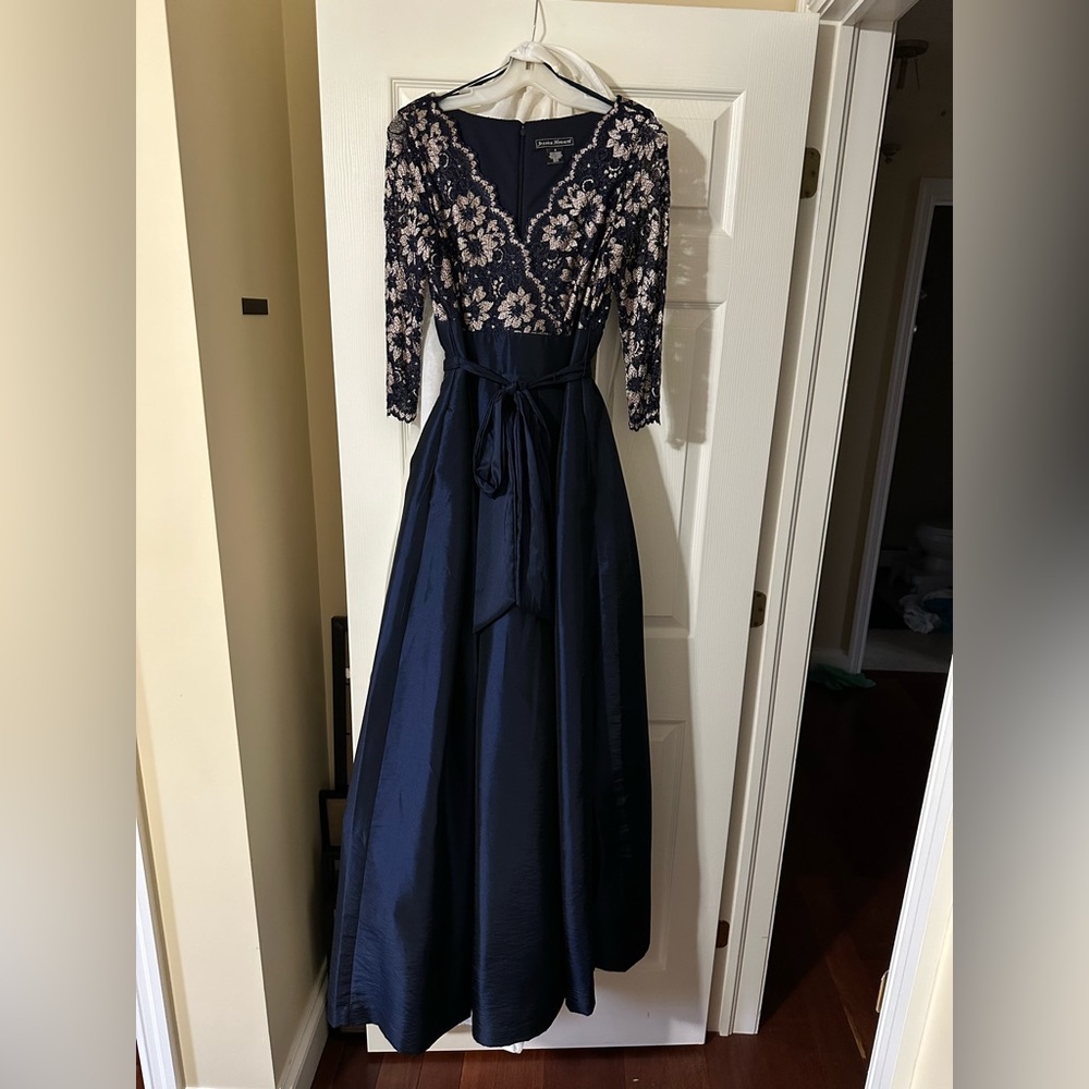 JESSICA HOWARD LONG SLEEVE SATIN NAVY GOWN WITH GOLD LACE BODICE